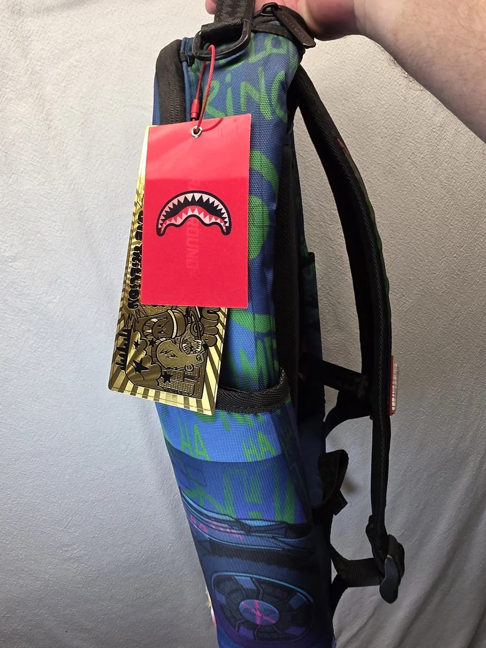 Sprayground DC Joker No Rules Backpack featuring a vibrant, graffiti-styled Bag